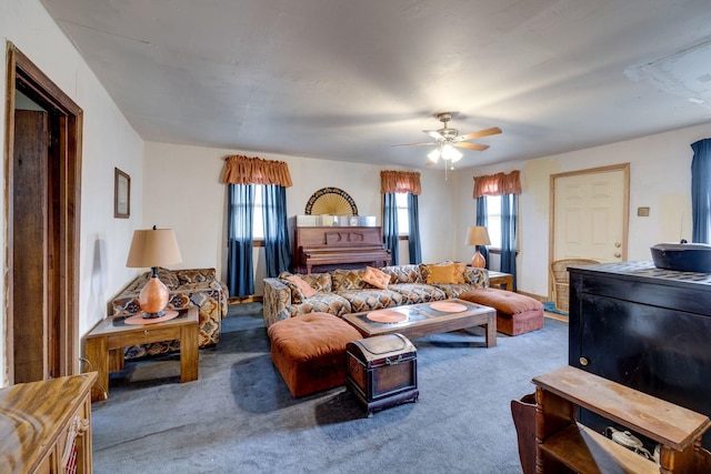 carpeted living room with ceiling fan