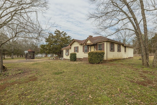 view of property exterior featuring a lawn