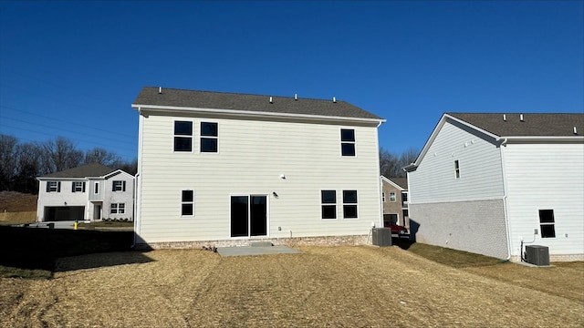 back of property with a patio and central air condition unit