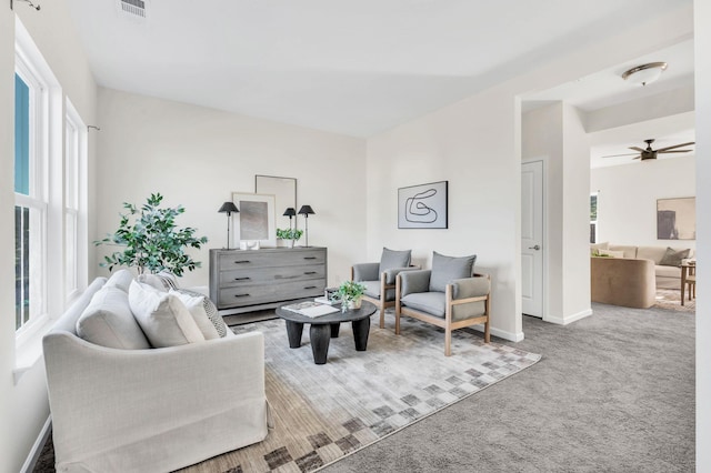 living room with plenty of natural light and carpet flooring