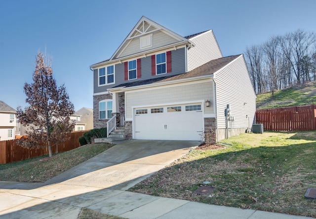 craftsman-style house with a garage and a front lawn