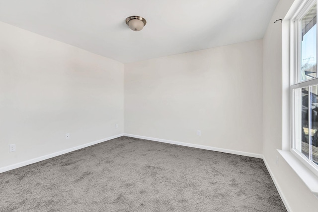 unfurnished room with carpet floors