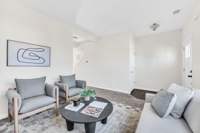 living room with beamed ceiling