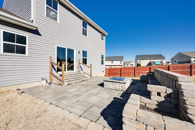 view of patio featuring a fire pit