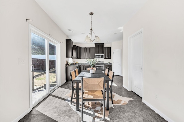 dining space featuring tile patterned flooring and sink