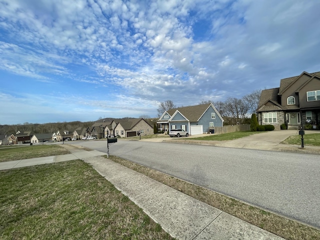 view of road featuring sidewalks and a residential view