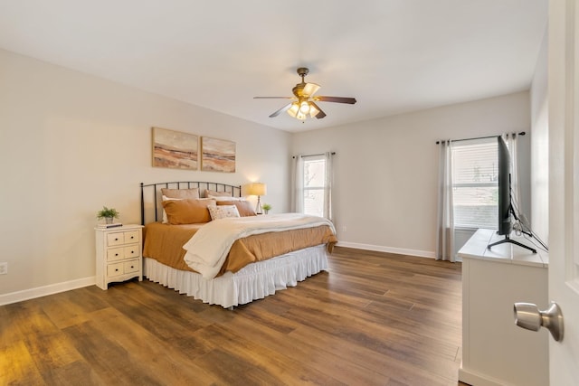 bedroom featuring dark hardwood / wood-style floors and ceiling fan