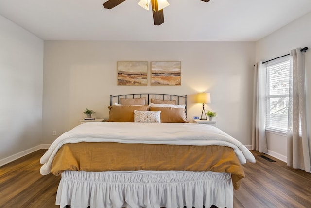 bedroom featuring dark wood-type flooring and ceiling fan