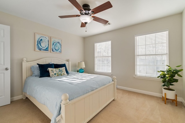 bedroom featuring ceiling fan and light colored carpet