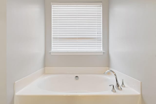 bathroom with a washtub