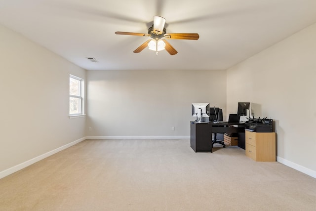 office featuring light carpet and ceiling fan