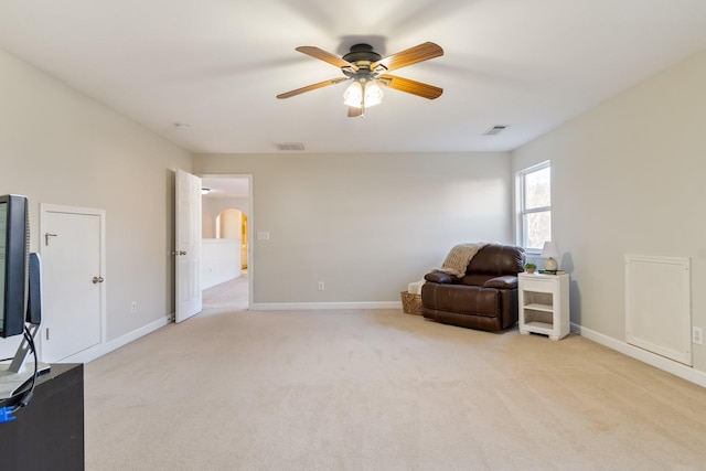 sitting room featuring light carpet and ceiling fan