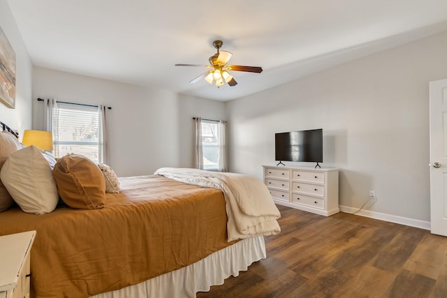 bedroom with dark hardwood / wood-style floors and ceiling fan