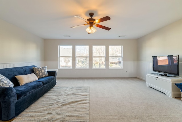 living room with light carpet and ceiling fan