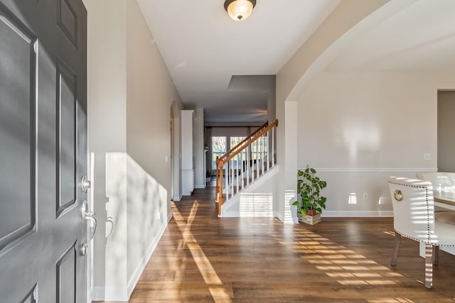 foyer entrance with dark wood-type flooring