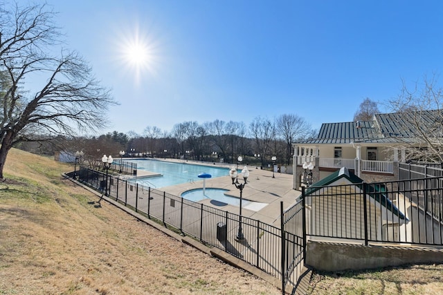 view of swimming pool featuring a patio area