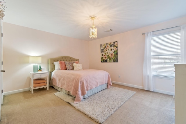 bedroom featuring light colored carpet