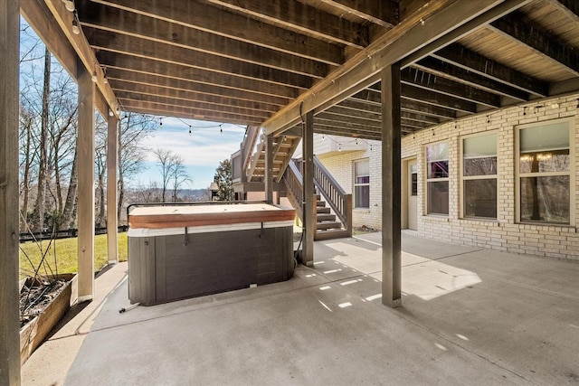 view of patio / terrace featuring a hot tub