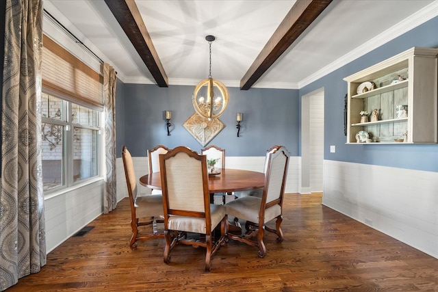 dining room featuring beamed ceiling, crown molding, dark hardwood / wood-style floors, and a chandelier