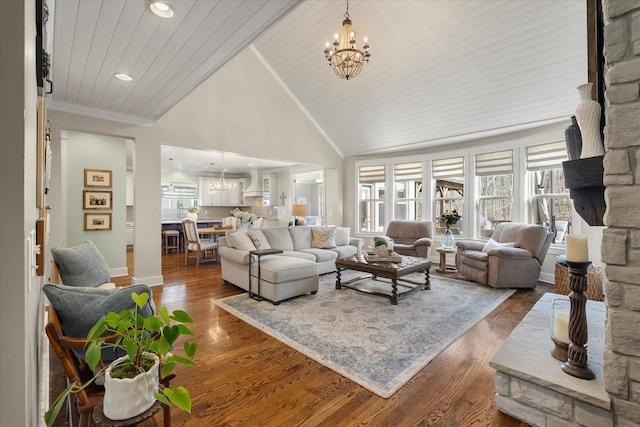 living room featuring crown molding, a chandelier, high vaulted ceiling, wooden ceiling, and dark hardwood / wood-style floors