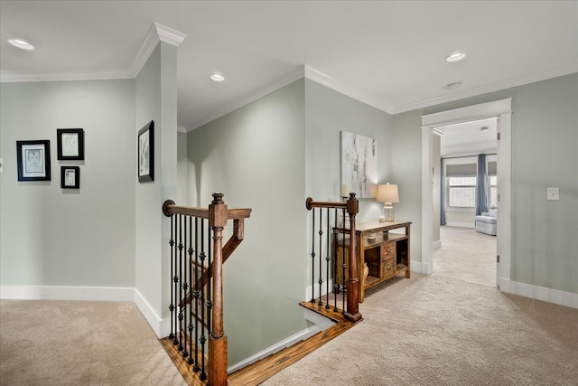 hall featuring light colored carpet and ornamental molding