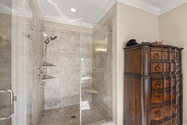 bathroom with ornamental molding and a shower with shower door