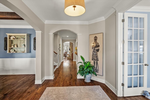 hall with dark hardwood / wood-style flooring and crown molding