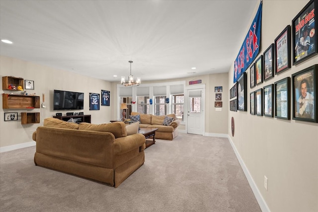 living room with light colored carpet and a chandelier