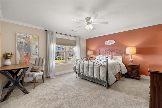 bedroom featuring crown molding, light colored carpet, and ceiling fan