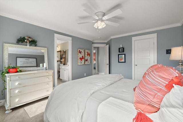 bedroom with crown molding, carpet flooring, ceiling fan, and ensuite bath