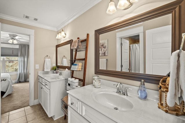 bathroom with tile patterned flooring, ornamental molding, vanity, and ceiling fan