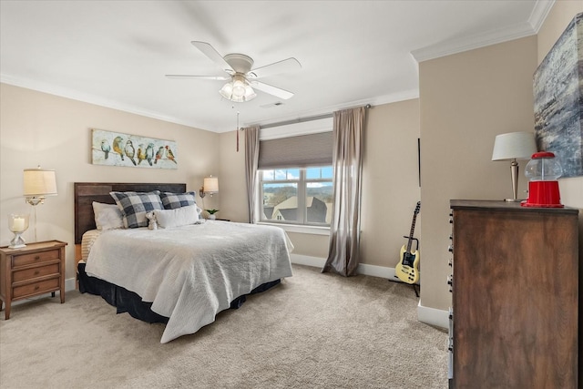 carpeted bedroom with crown molding and ceiling fan