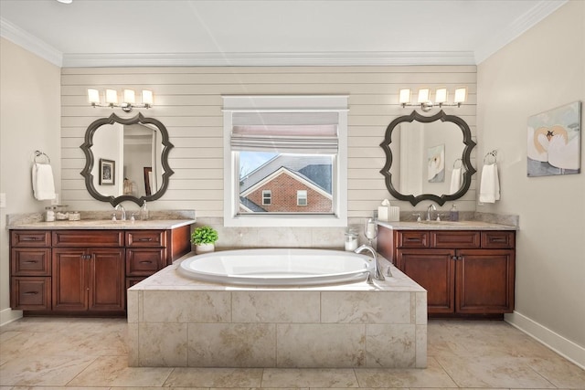 bathroom featuring vanity, tiled tub, and crown molding