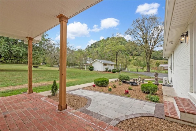 view of patio with an outdoor structure