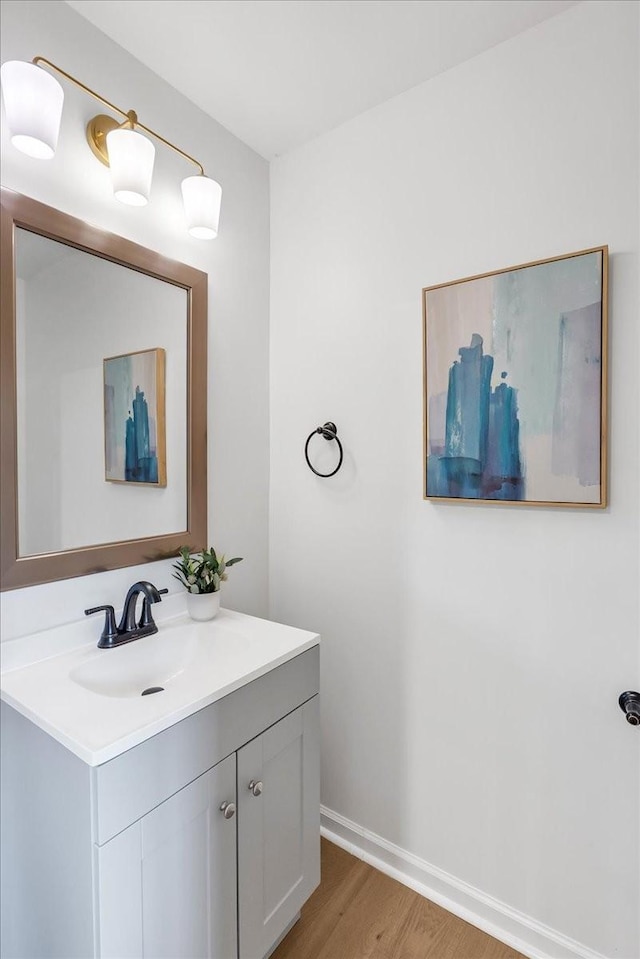 bathroom with vanity and hardwood / wood-style floors