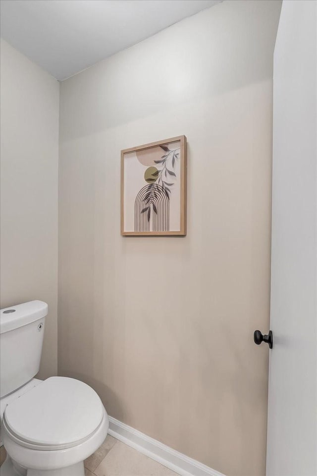 bathroom with tile patterned floors and toilet