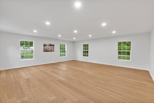 spare room featuring light hardwood / wood-style floors