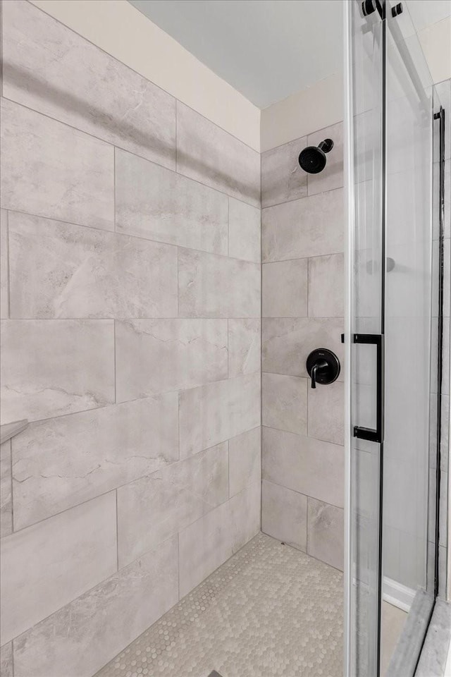 bathroom with a tile shower