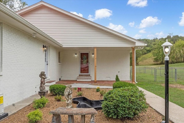 property entrance with a yard