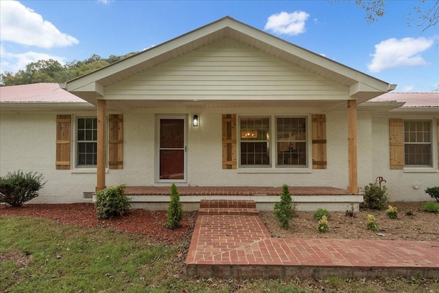 view of front of property featuring covered porch