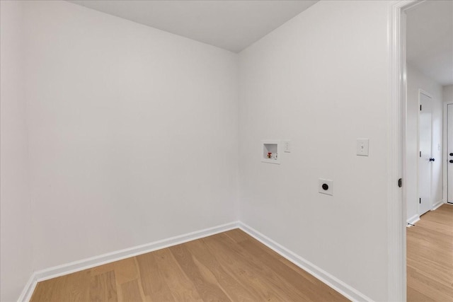 washroom with electric dryer hookup, washer hookup, and light wood-type flooring