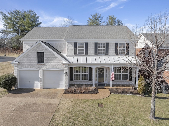 view of front of house featuring a garage and a front yard