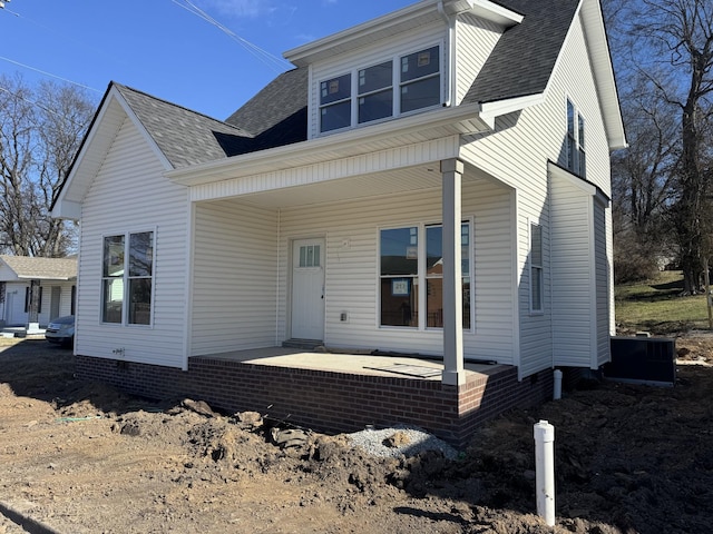 view of front of property featuring central AC unit and covered porch