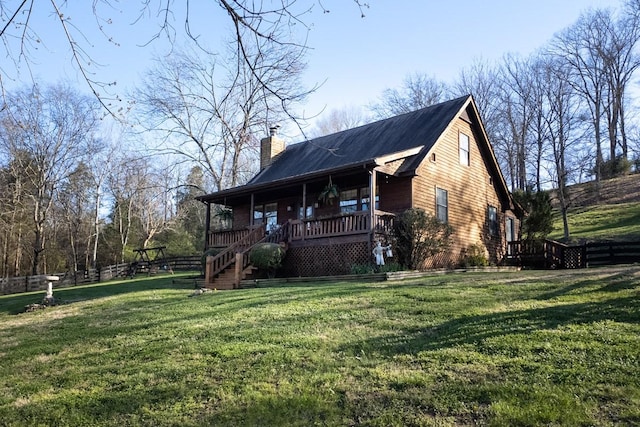 exterior space with a porch and a lawn