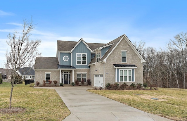 view of front facade with a garage and a front yard