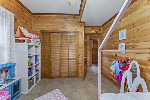 playroom featuring wooden walls