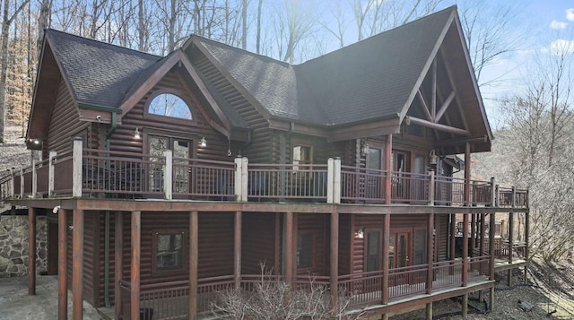 rear view of property featuring french doors