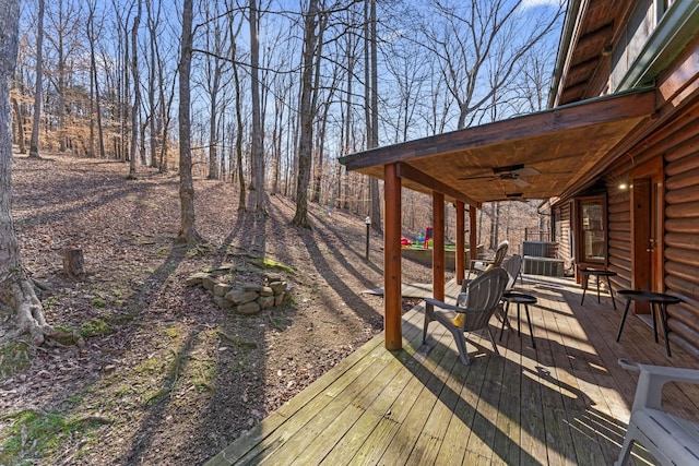 wooden terrace featuring ceiling fan