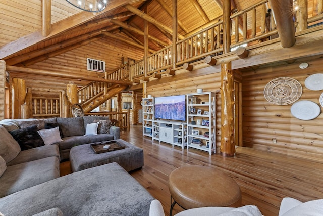 living room with high vaulted ceiling, wood-type flooring, rustic walls, wooden ceiling, and beam ceiling