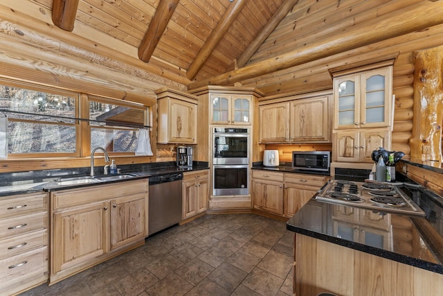 kitchen with sink, stainless steel appliances, log walls, and high vaulted ceiling